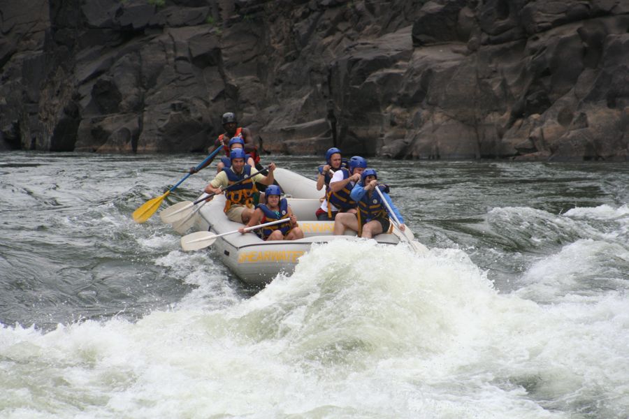 A raft punching into a big rapid in the Batoka Gorge