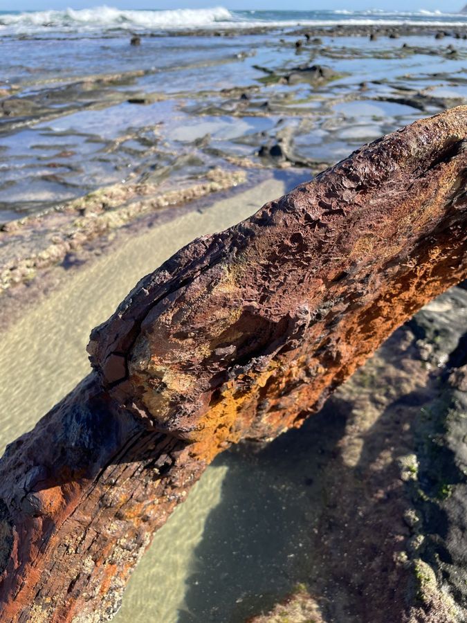 A rusted shipwreck anchor on Wreck Beach